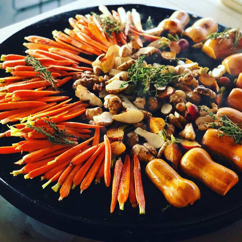 Assorted vegetables, including carrots and gourds on an EVO Grill