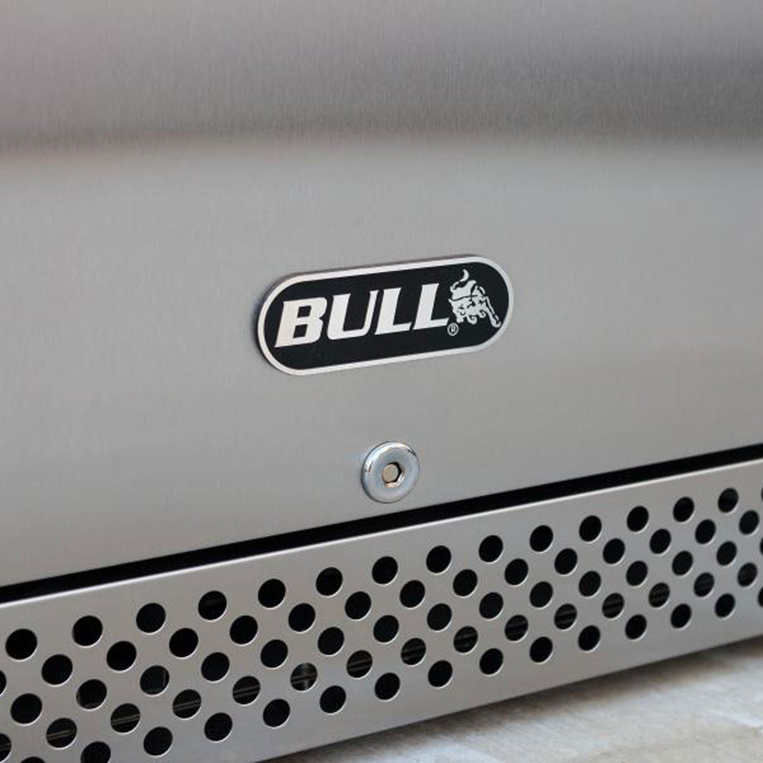 Stainless outdoor refrigerator logo badge above front vent holes