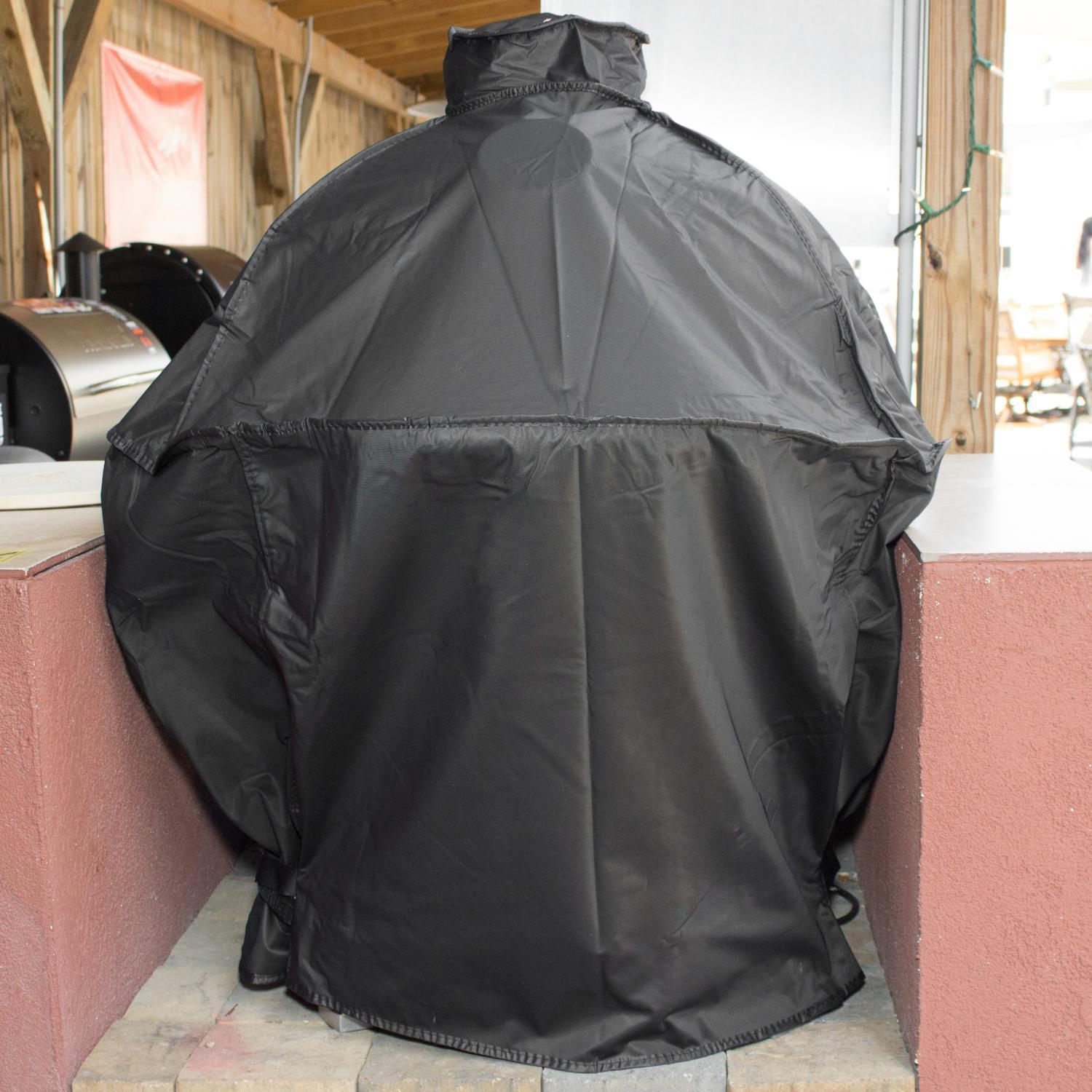 Black vinyl kamado grill cover with hood and snug base hem