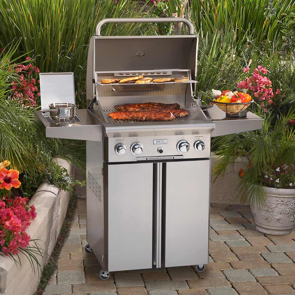 Stainless steel gas grill with open lid, cooking grates, and side prep shelf.