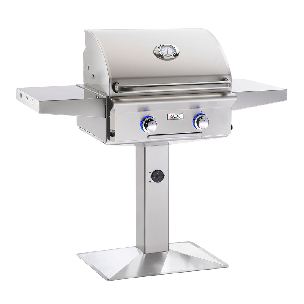 Stainless steel gas grill with lid and two front control knobs on pedestal base