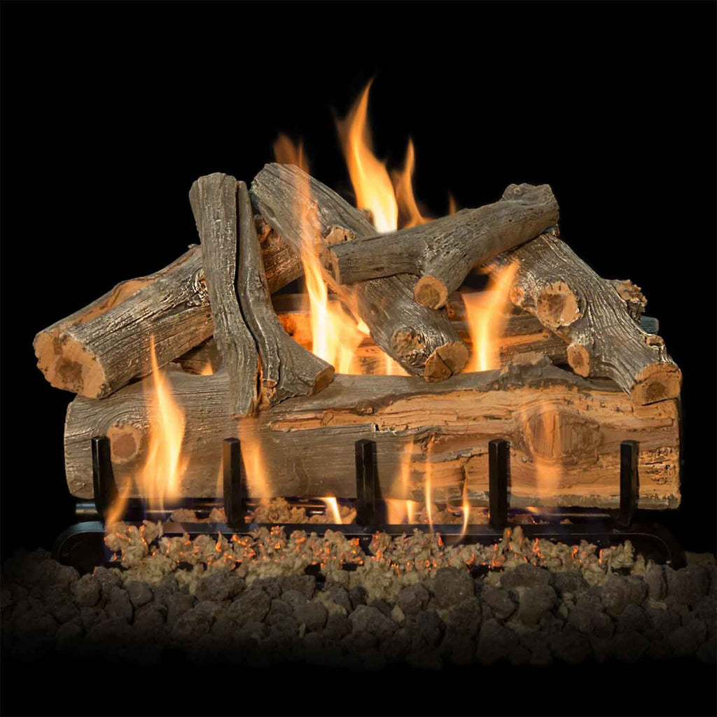 Vented gas log set with burning logs and flames over a dark ember bed