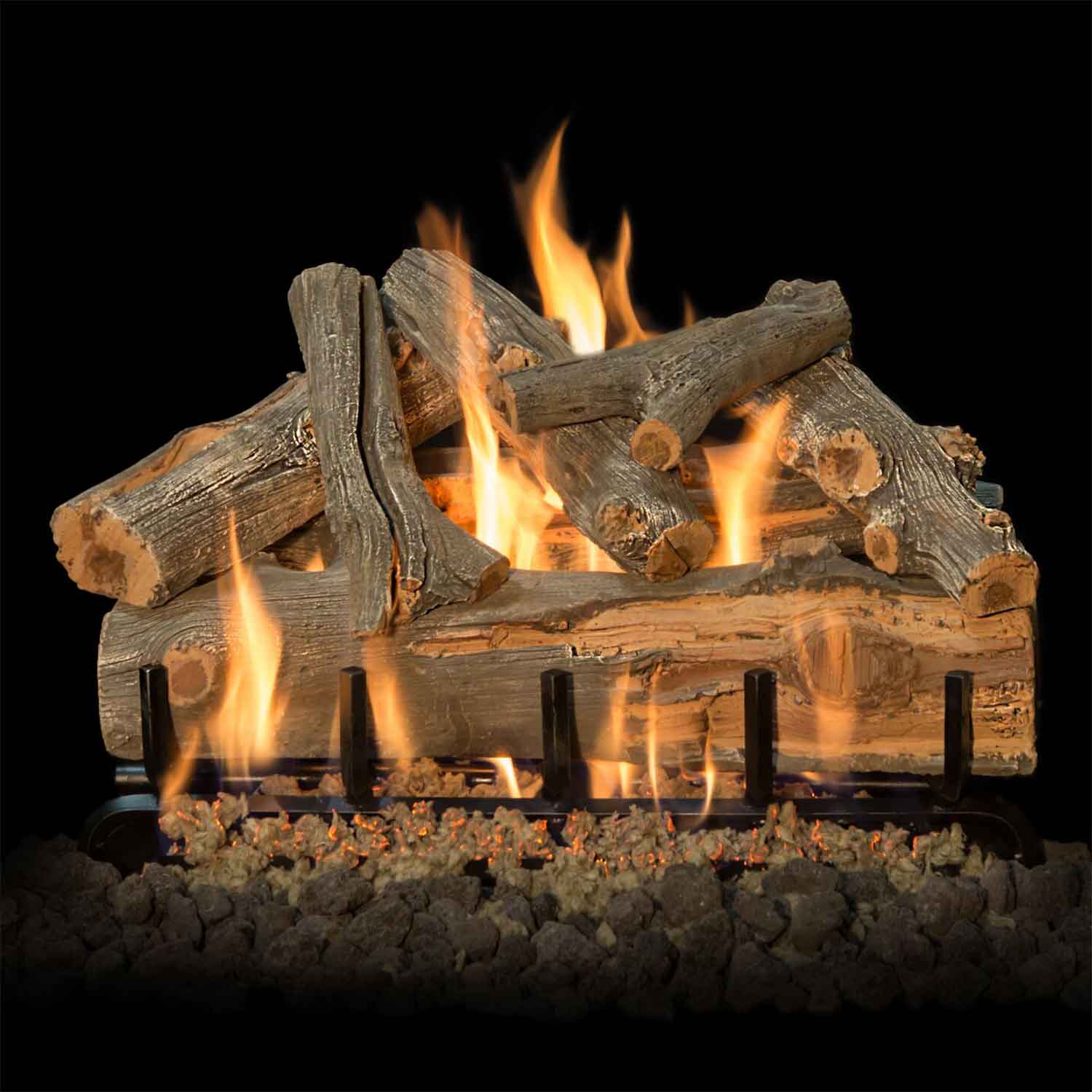 Vented gas log set with burning logs and flames over a dark ember bed