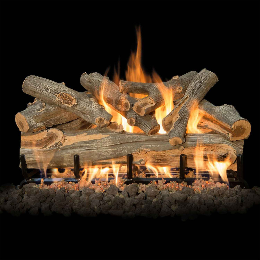 Vented gas log set with burning faux logs and bright flames above a lava rock ember bed