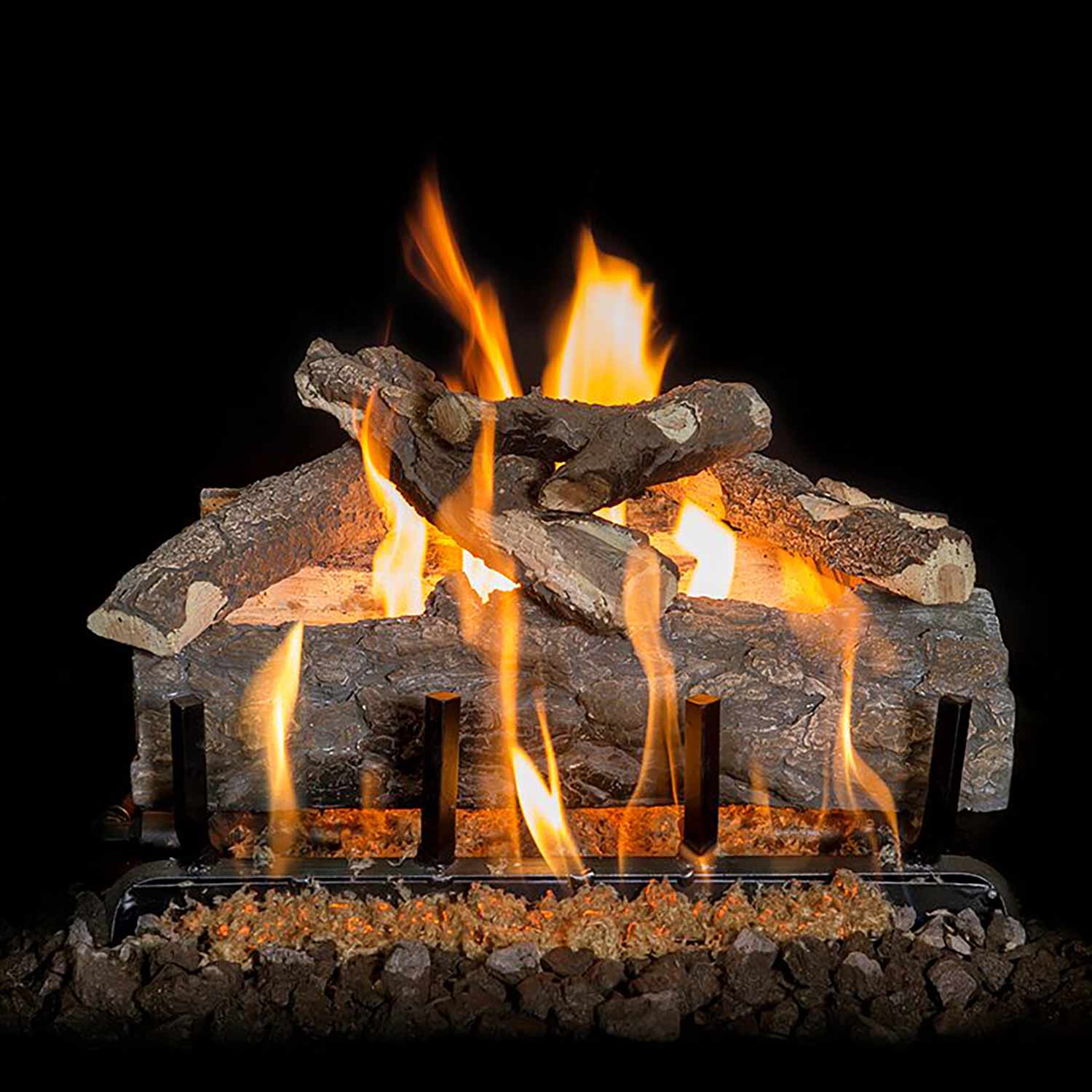 Gas log set with split gray logs, bright flames, and ember bed on base