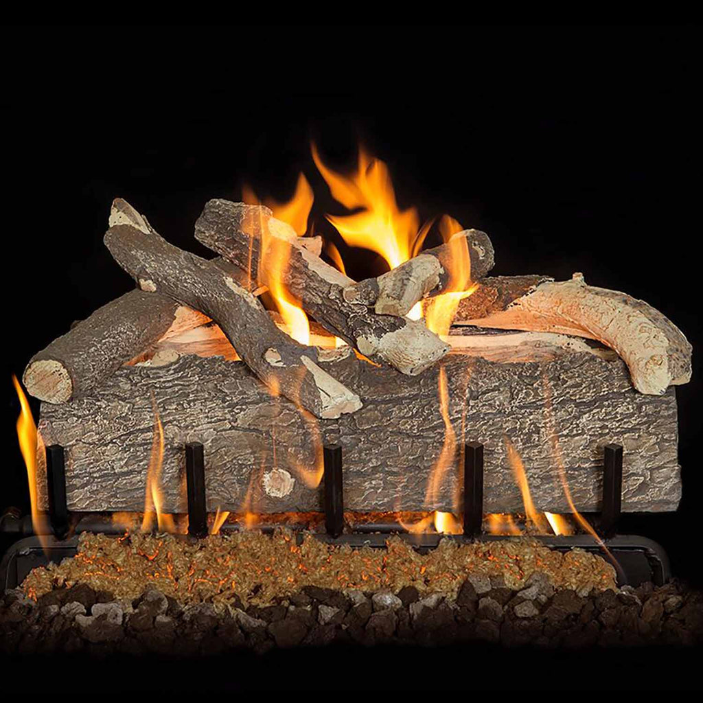 Split pine gas log set with orange flames and dark log burner grate