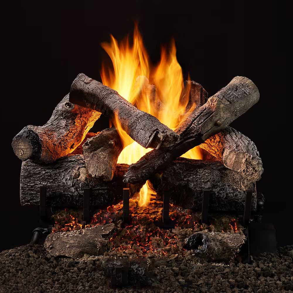 Indoor vented gas log set with burning logs and ember bed