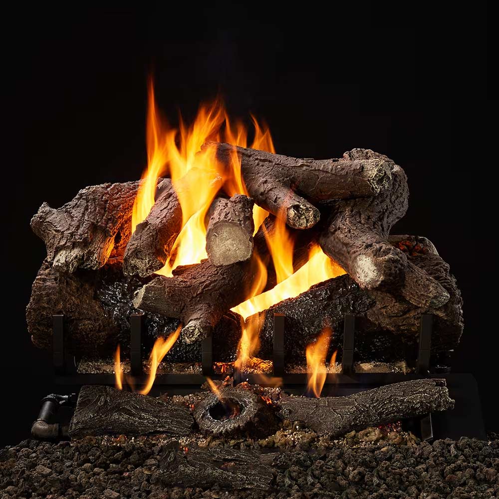 Indoor vented gas log set with bright flames in a faux oak log arrangement