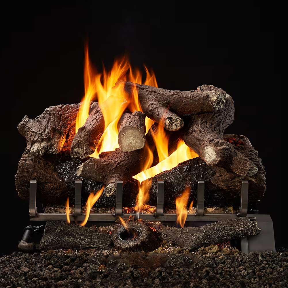 Dark oak-style ceramic gas logs with tall flames over a metal burner grate