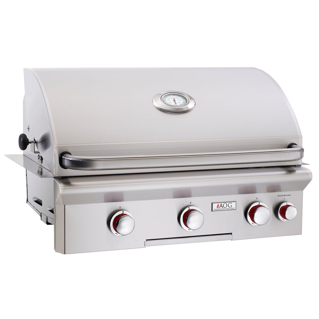Stainless steel built-in gas grill with closed lid and control knobs