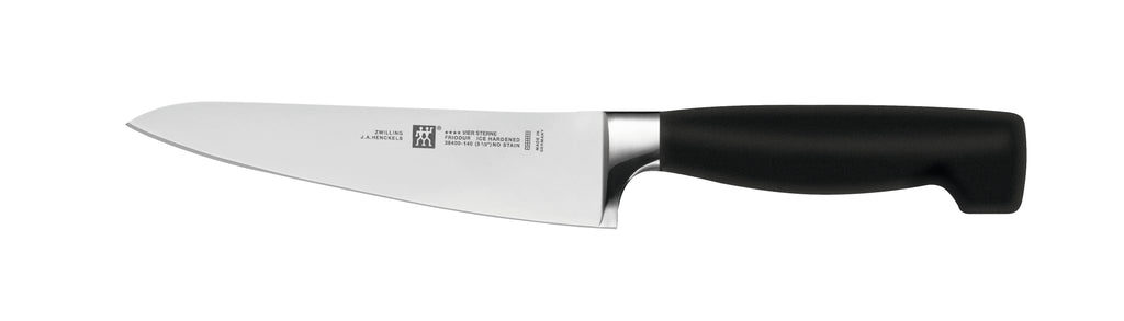 Zwilling Four Star 5.5-inch prep knife with black handle and stainless blade