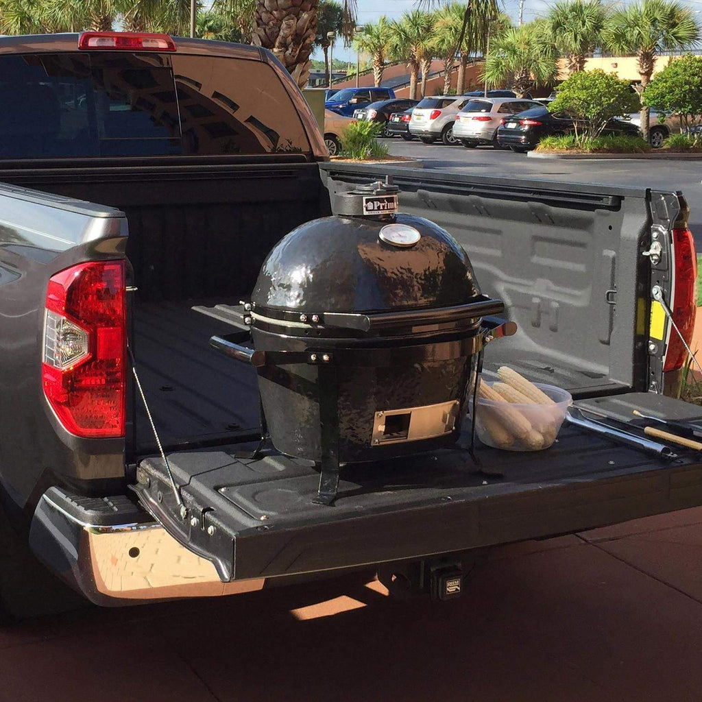 Black round grill on portable cradle with side vent and front access panel