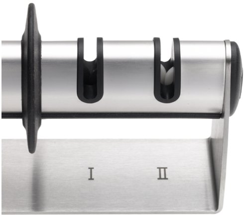 Stainless steel knife sharpener close-up with two guide openings labeled I and II