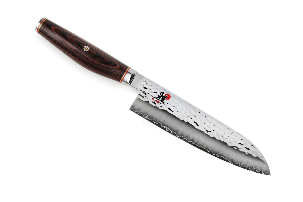 Santoku kitchen knife with dark wood handle and stainless steel blade