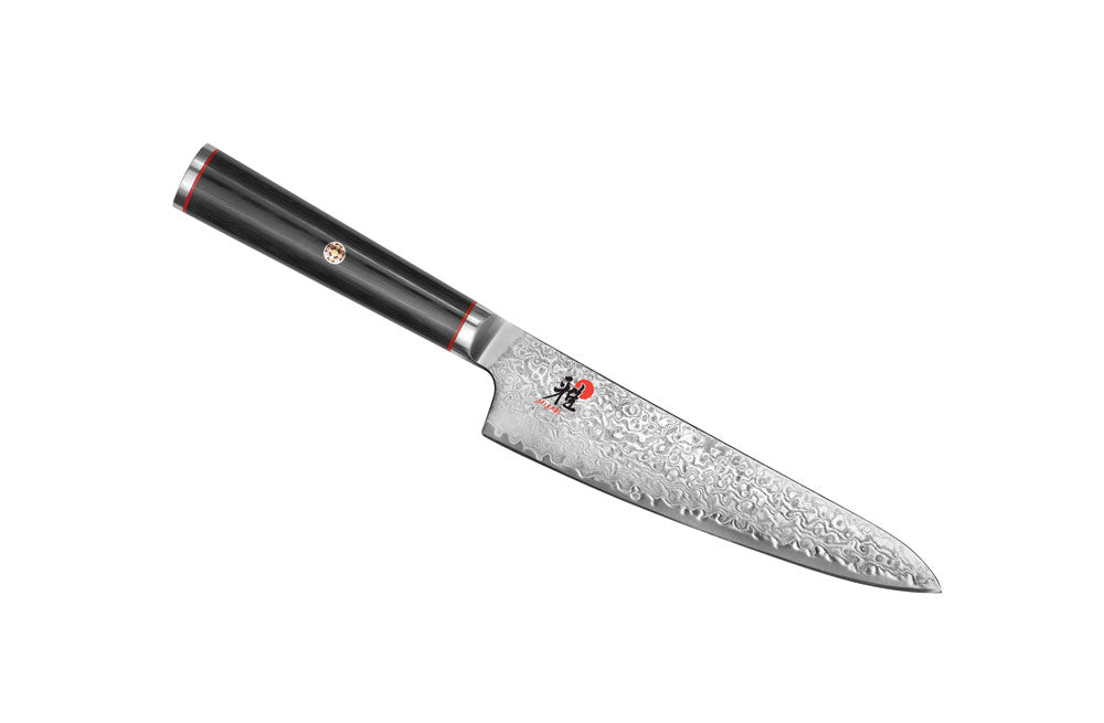 5.25-inch prep knife with silver Damascus-style blade and black handle with red rings