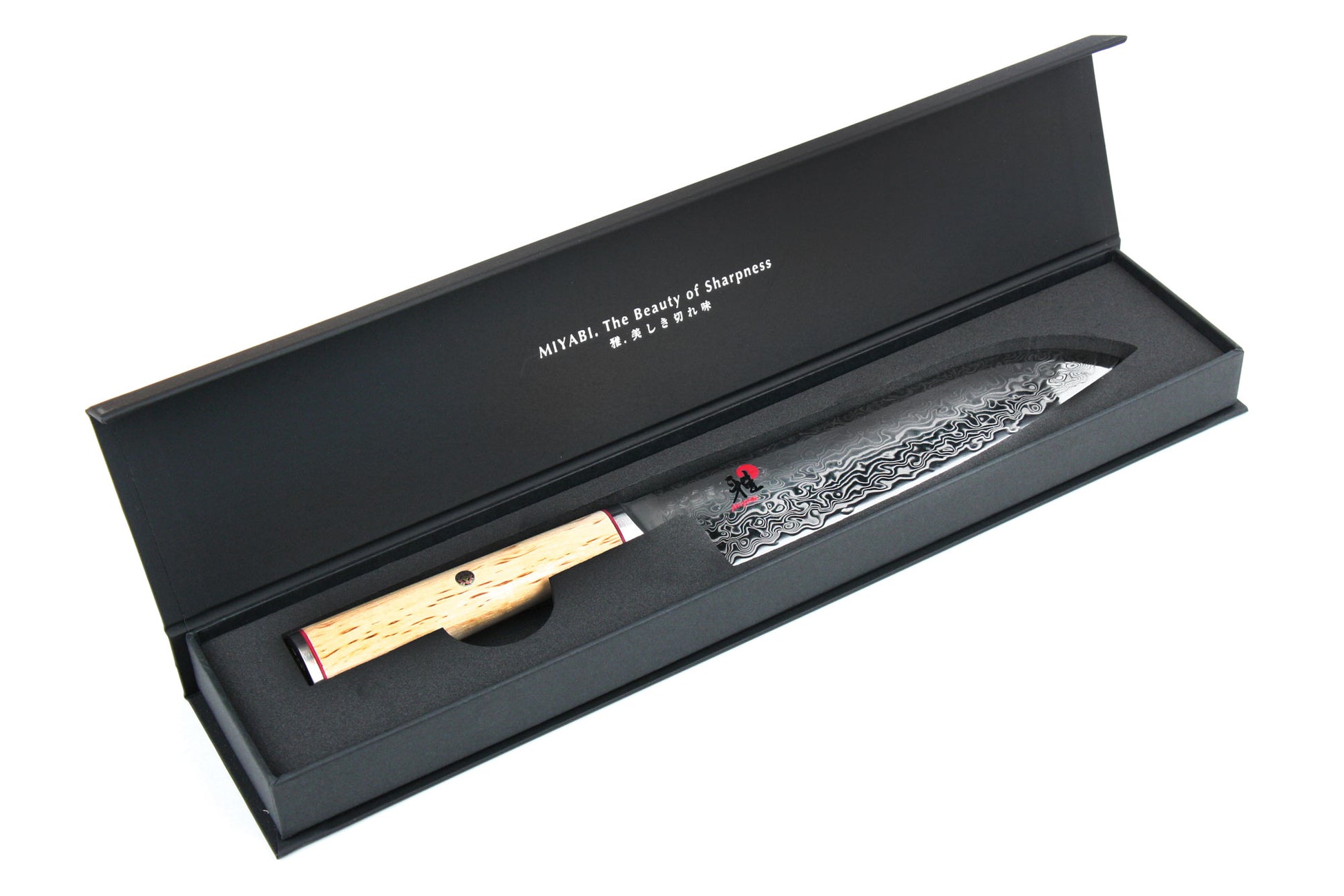 7-inch santoku knife in open box, birchwood handle and patterned steel blade