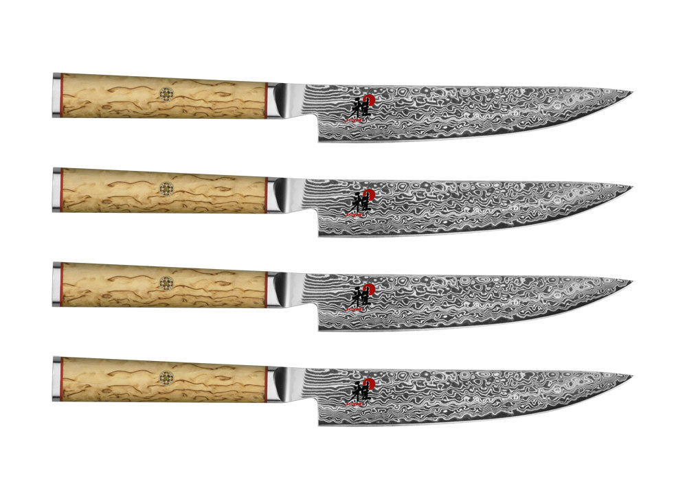 4-piece steak knife set with Damascus-style blades, four knives shown