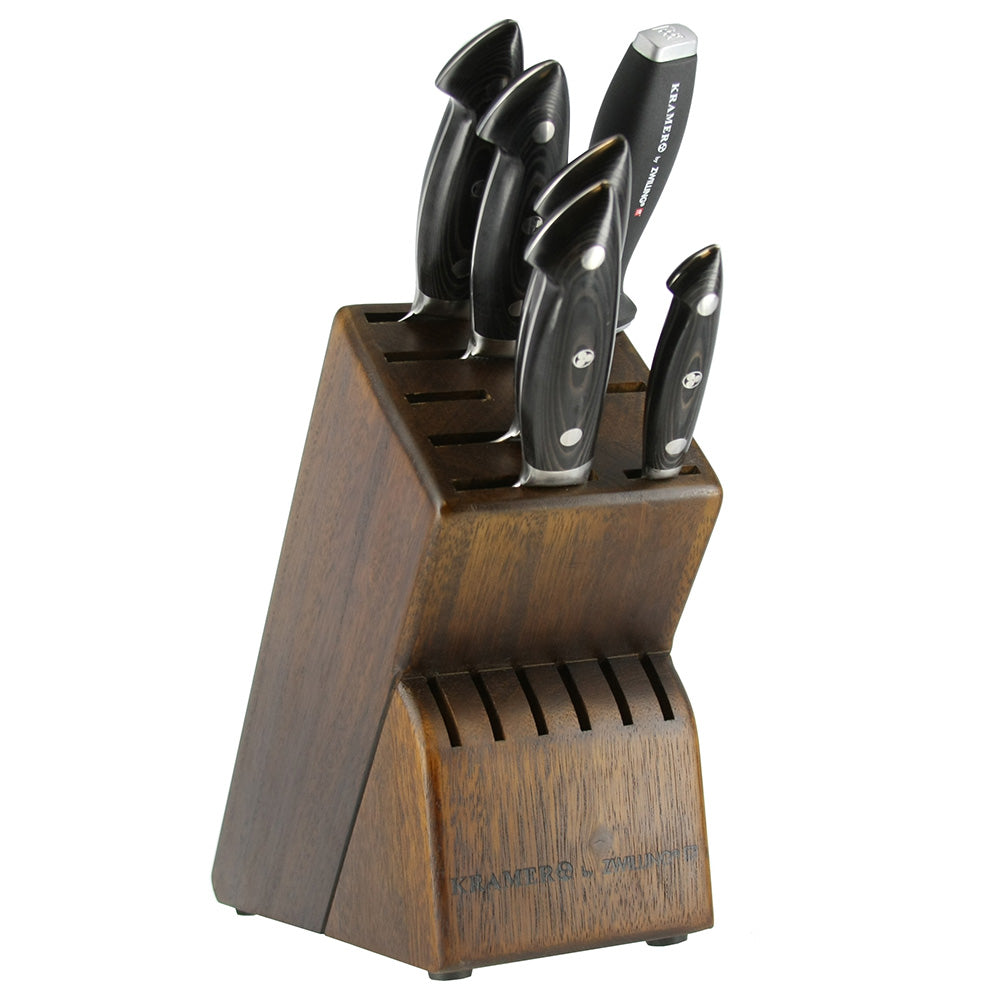 Wooden knife block with dark-handled stainless knives, stored in slots