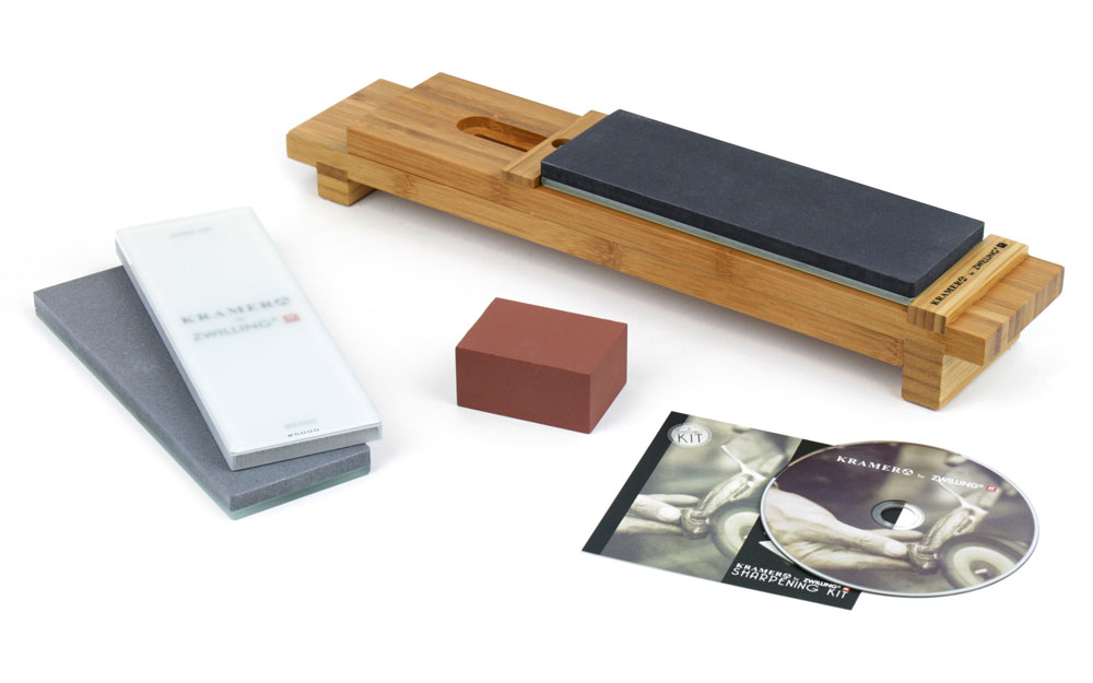 Knife sharpening set with glass water stones, wooden base, and honing accessory