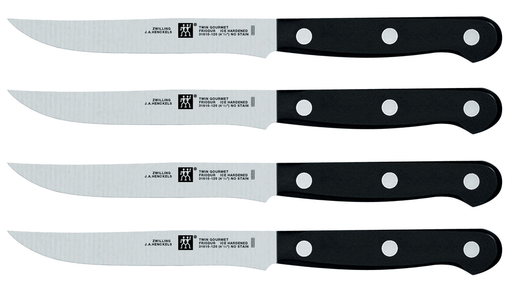 4-piece steak knife set with stainless blades and black round-bolster handles