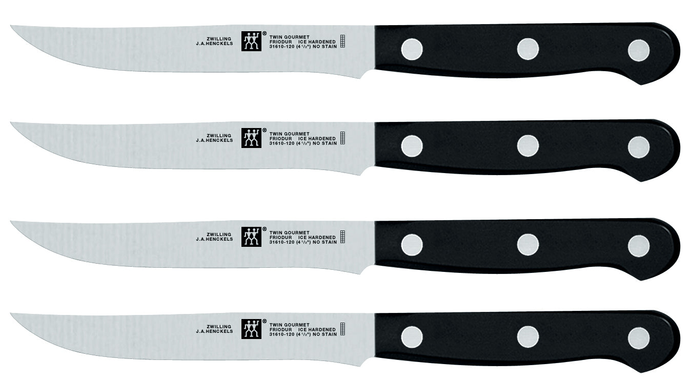 4-piece steak knife set with stainless blades and black round-bolster handles