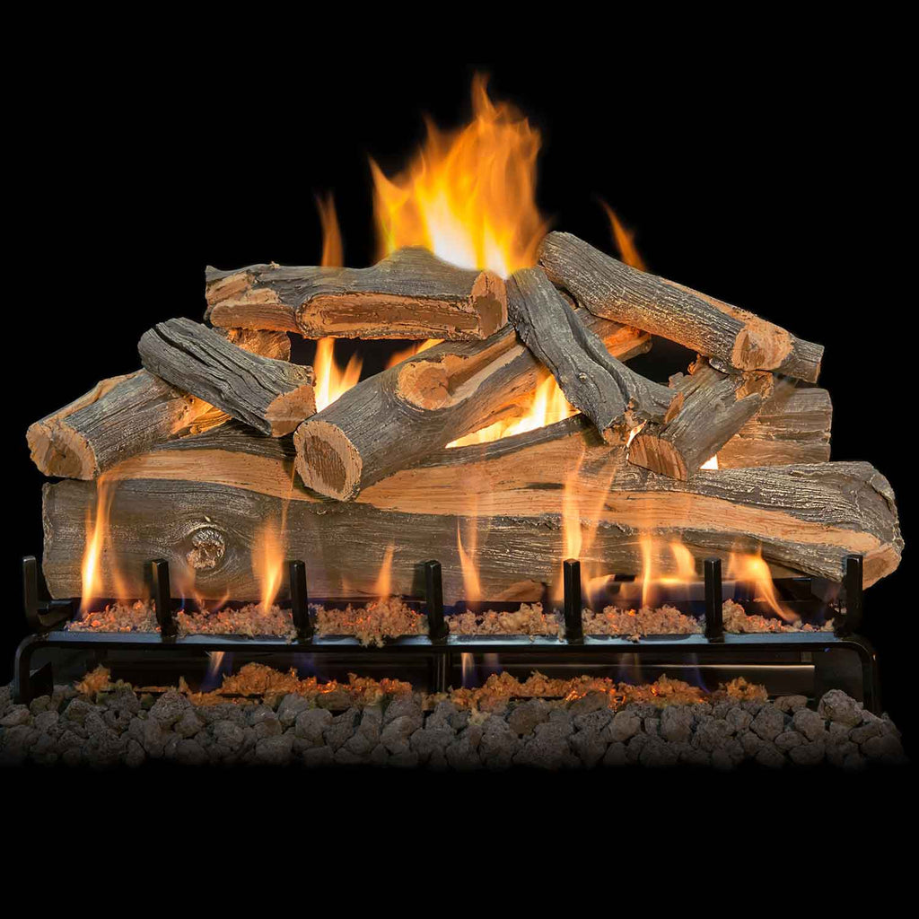 Vented gas log set with burning faux wood logs and flames across the burner grate