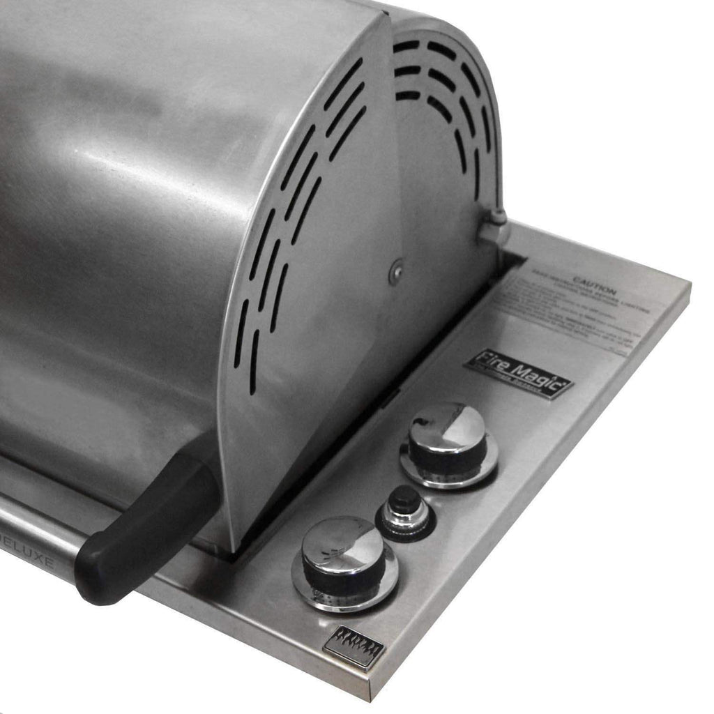Fire Magic gas grill control panel with three round burner knobs