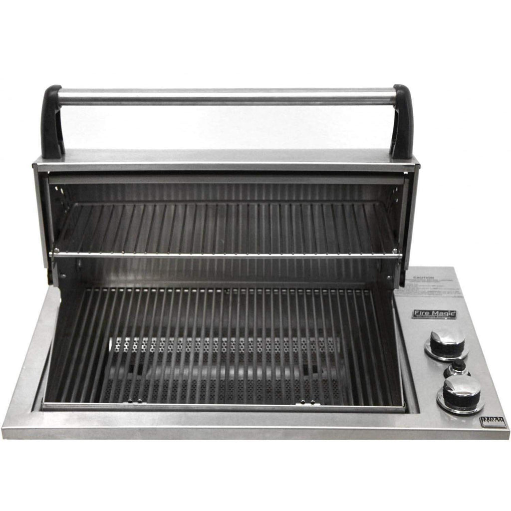 Fire Magic built-in gas grill with lid open and stainless cooking grates