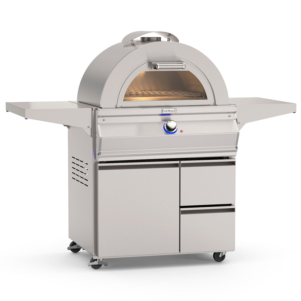 Freestanding gas pizza oven with open dome and glowing baking chamber, control knob front