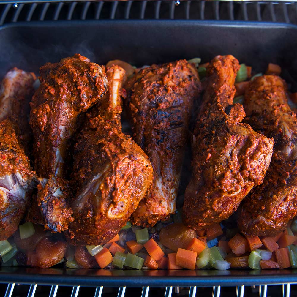 Napoleon Grill roasting pan close-up of browned chicken over diced vegetables