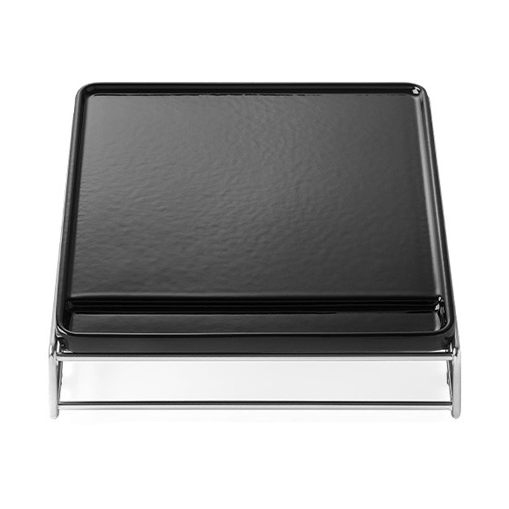 Cast iron griddle with black cooking plate and hinged metal frame