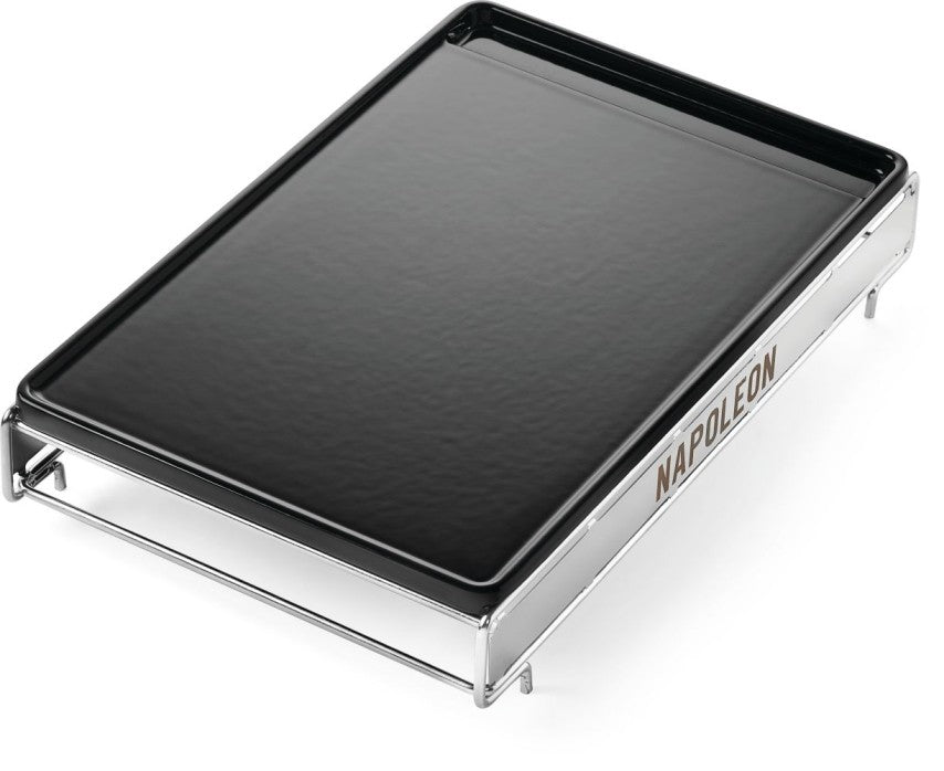 Cast iron griddle with black top and metal frame, Napoleon label on side