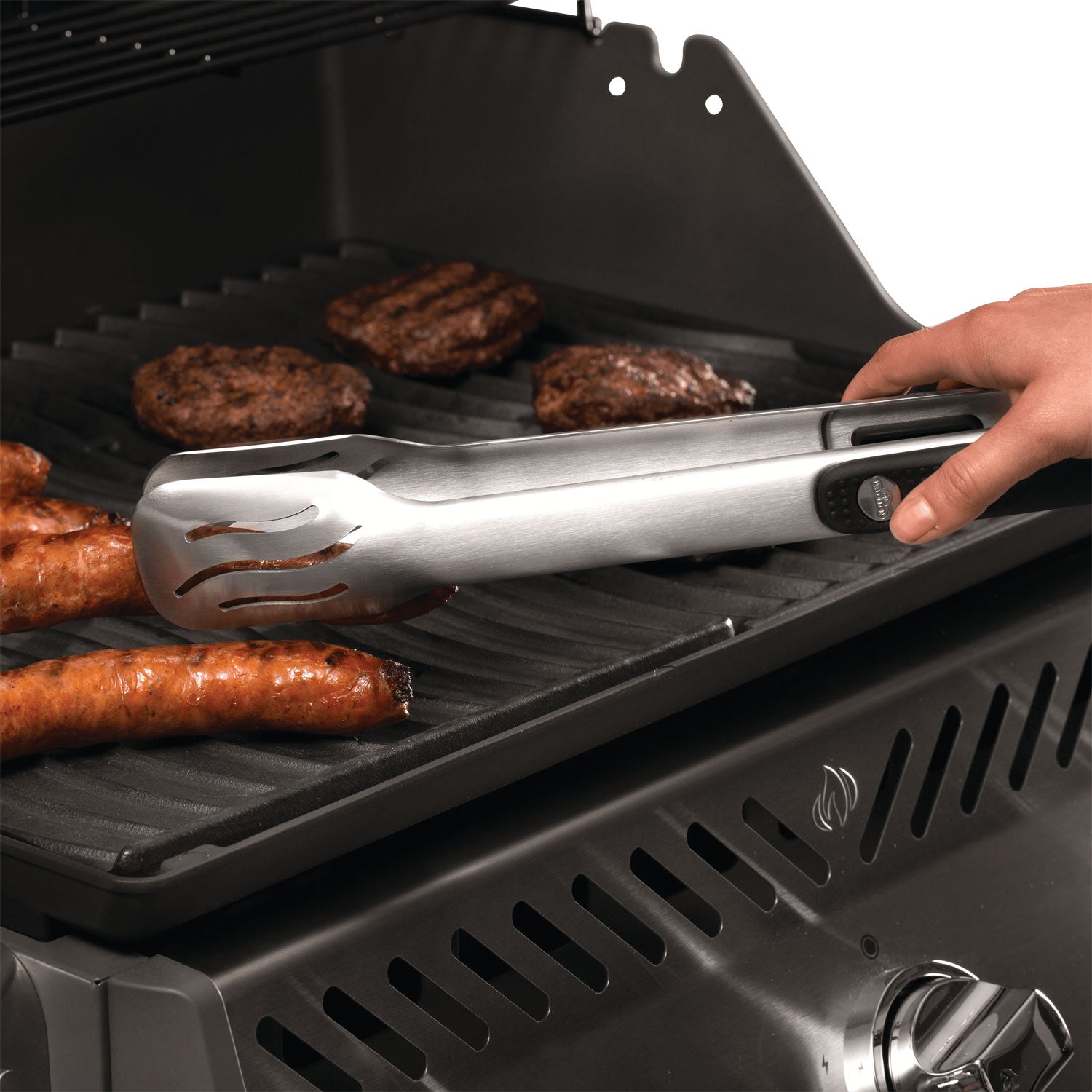 Cast iron reversible griddle on a grill rack, with handle and drip grooves