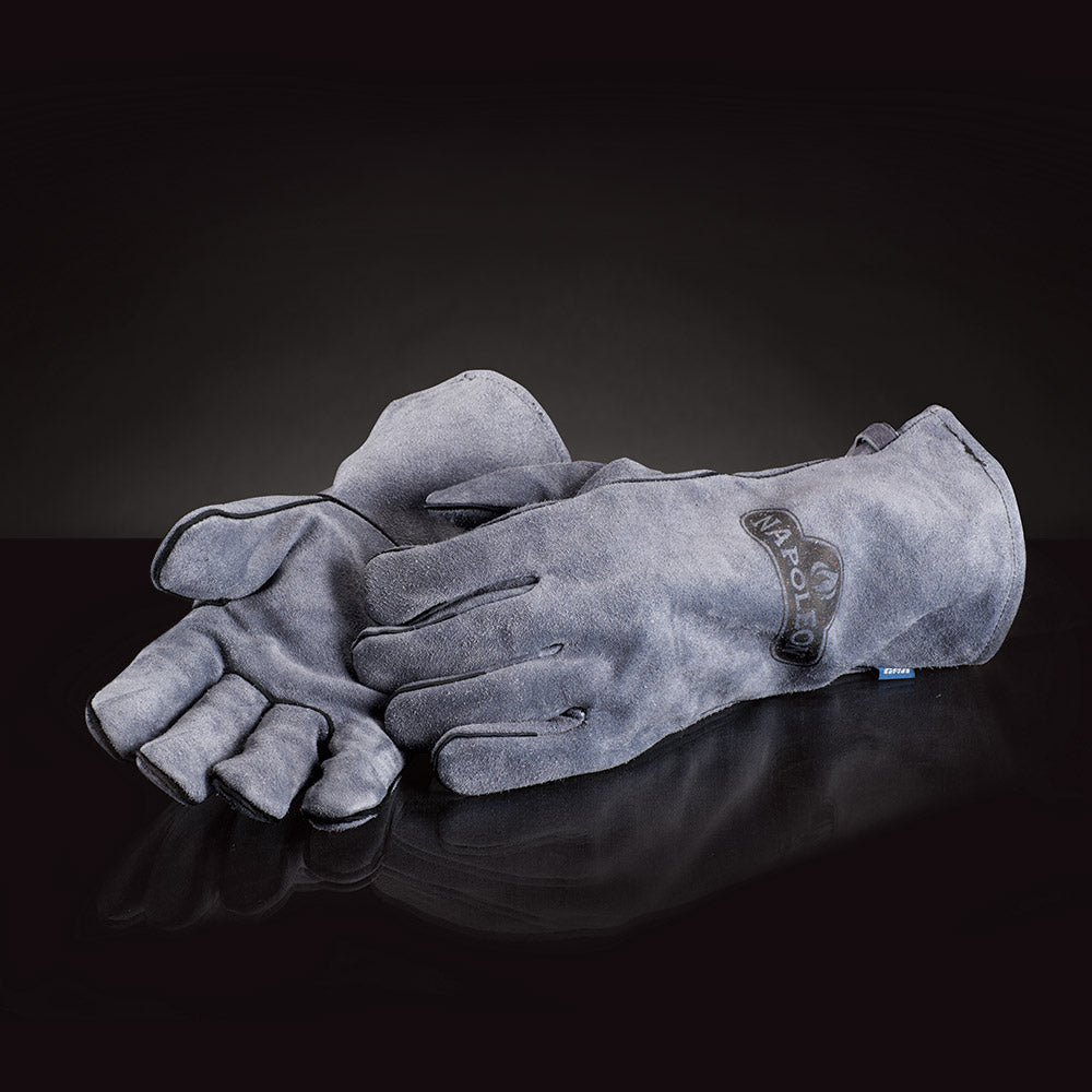 Gray leather gloves with logo patch and wrist strap; one glove extended