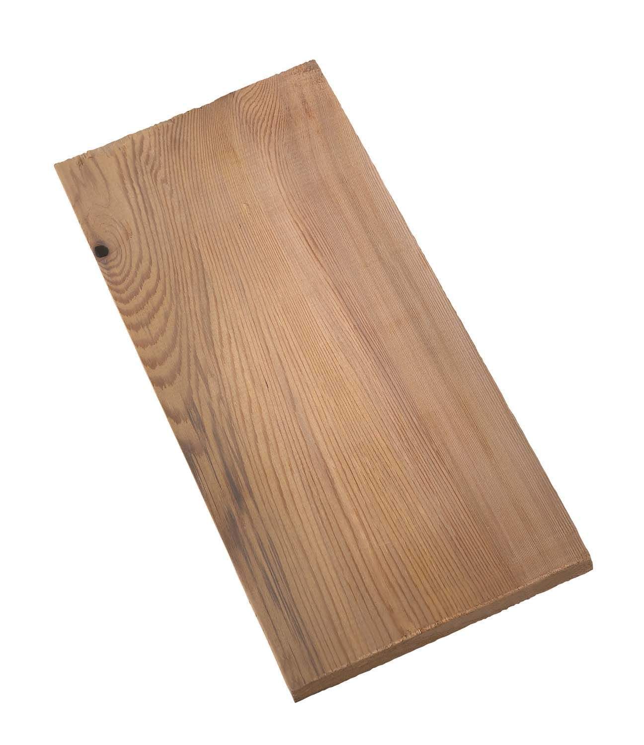 Cedar grill plank with visible wood grain and a small knot