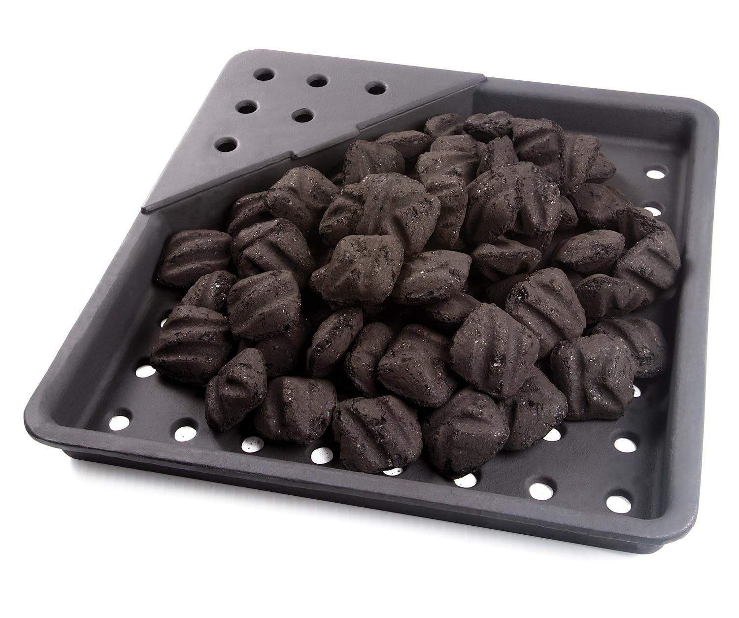 Charcoal smoker tray filled with dark briquettes and vent holes, cast iron