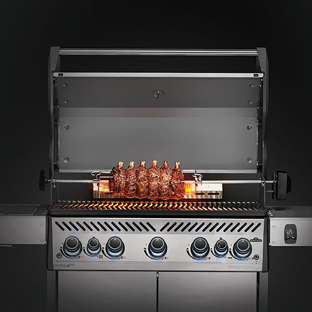 Rotisserie kit on grill: stainless spit rod with frame above burners