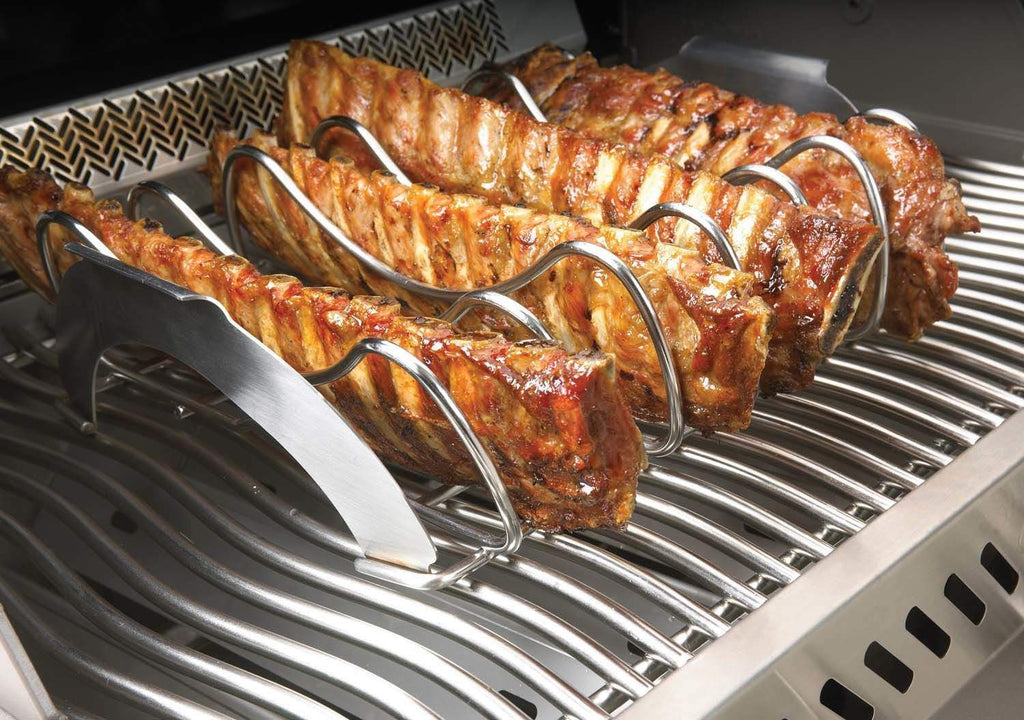 Stainless steel rib and roast rack holding ribs on wire grill grates