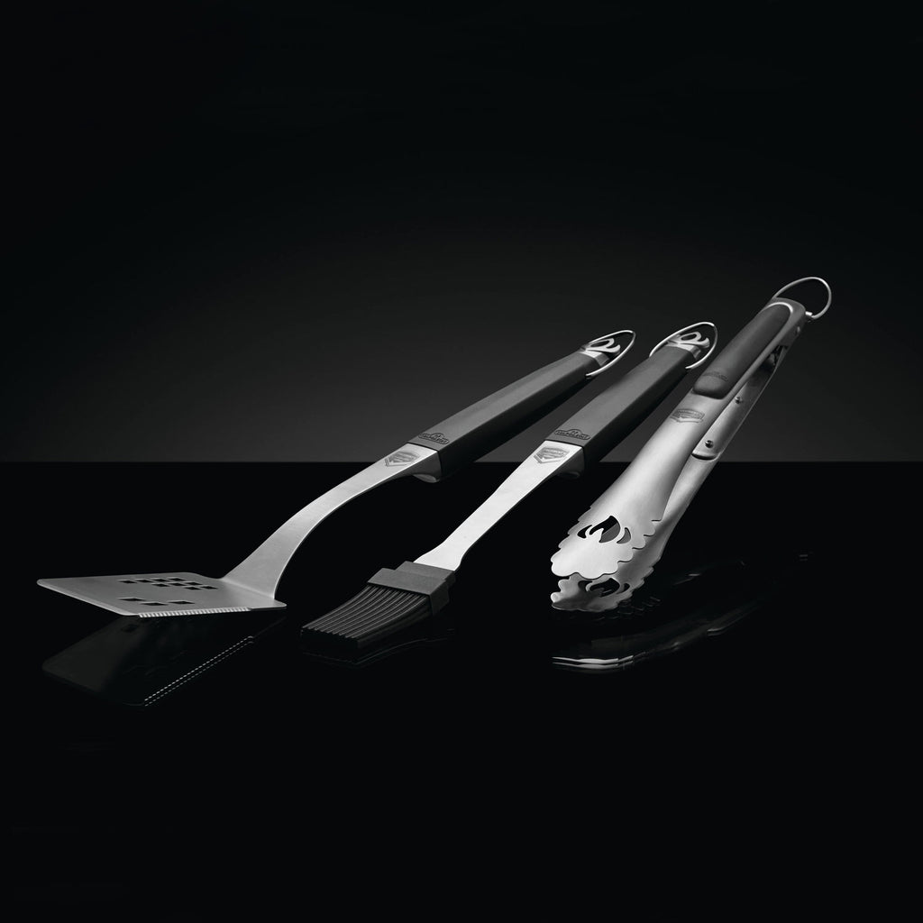 Napoleon 3-piece grill tool set with spatula, fork, and brush, angled