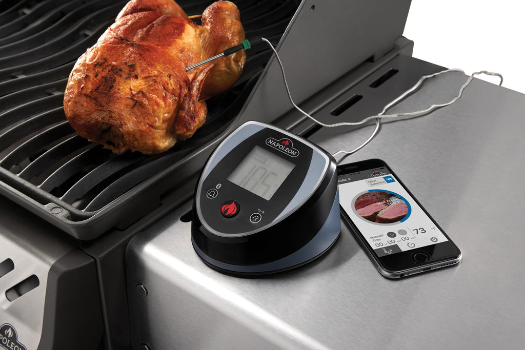 Bluetooth thermometer with LCD on grill surface, connected to smartphone app