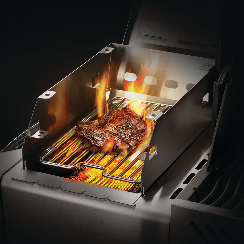Stainless steel side burner windshield and skewer rack with steaks on grill bars