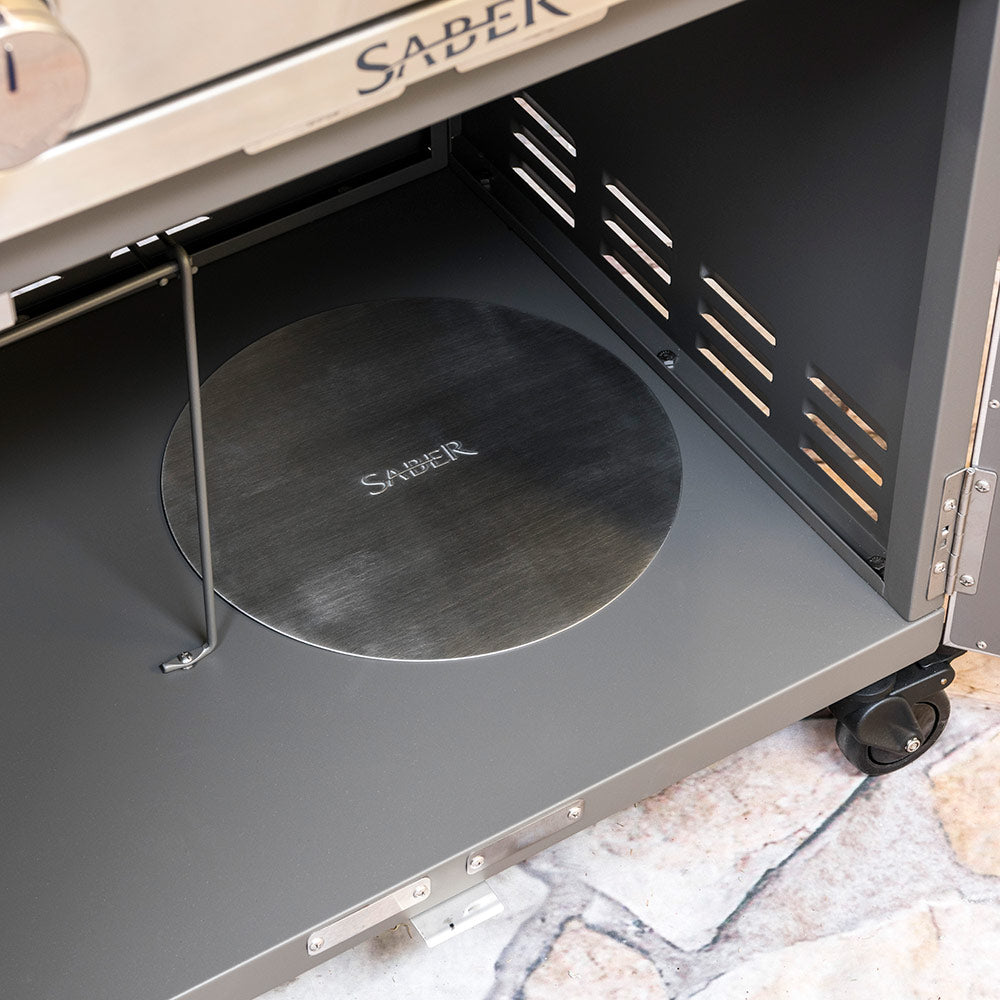 Stainless steel propane tank hole cover installed inside grill base opening