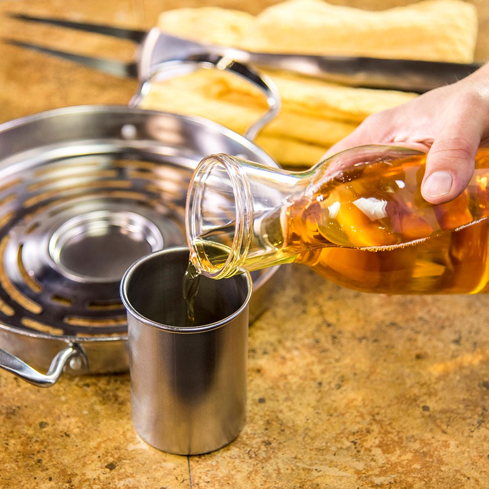 Stainless steel roaster cup under poured cooking oil, wide center opening
