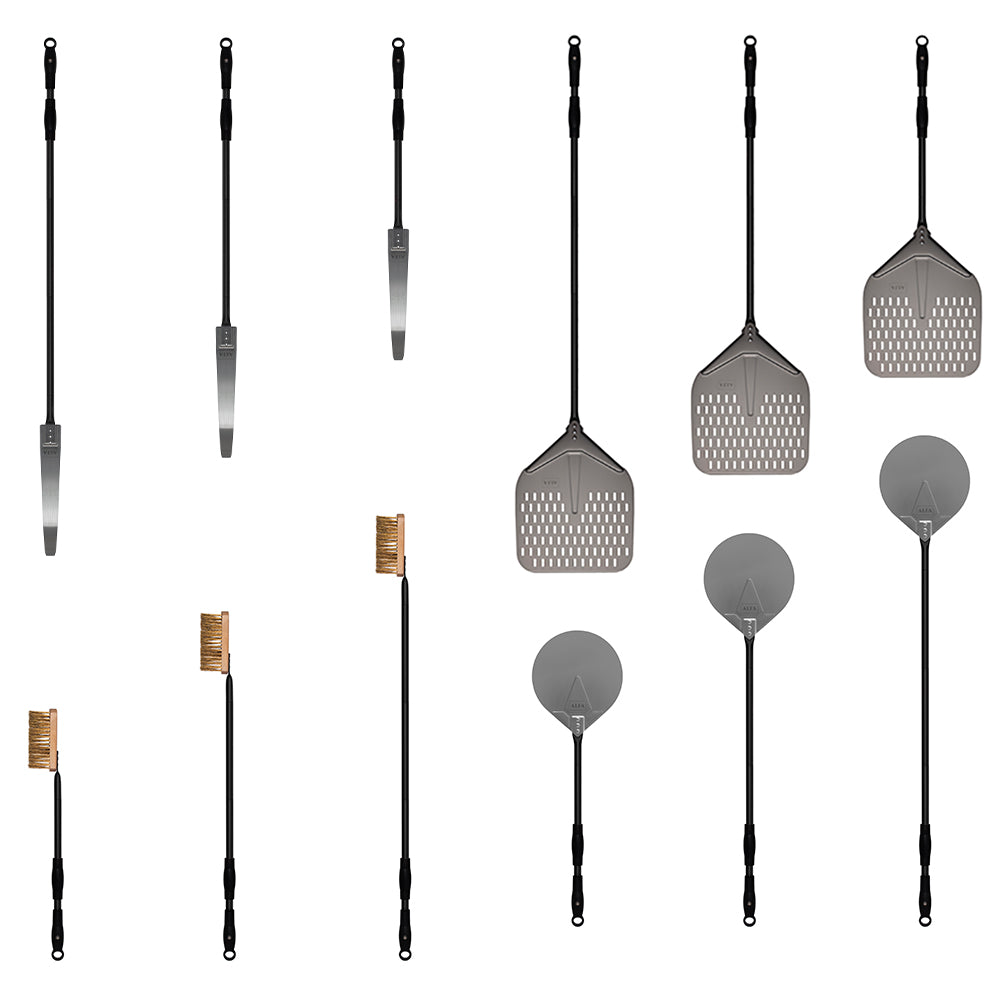 Pizza peel set tools laid out: peels, brush, rake, and shovel with long handles