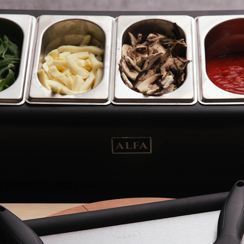 Topping station front view with four filled compartments and ALFA badge on base