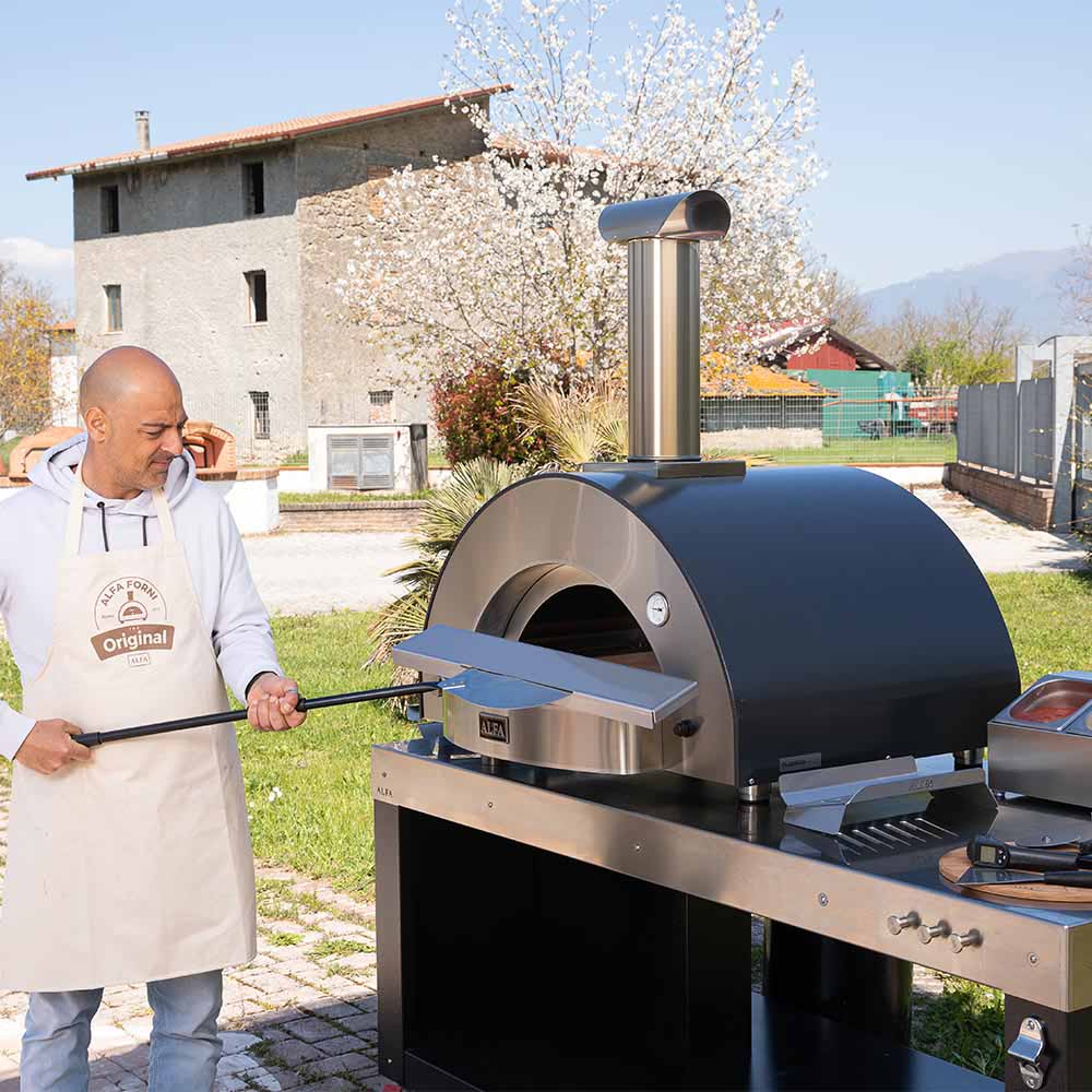 Outdoor wood-fired pizza oven with arched dome and stainless steel base