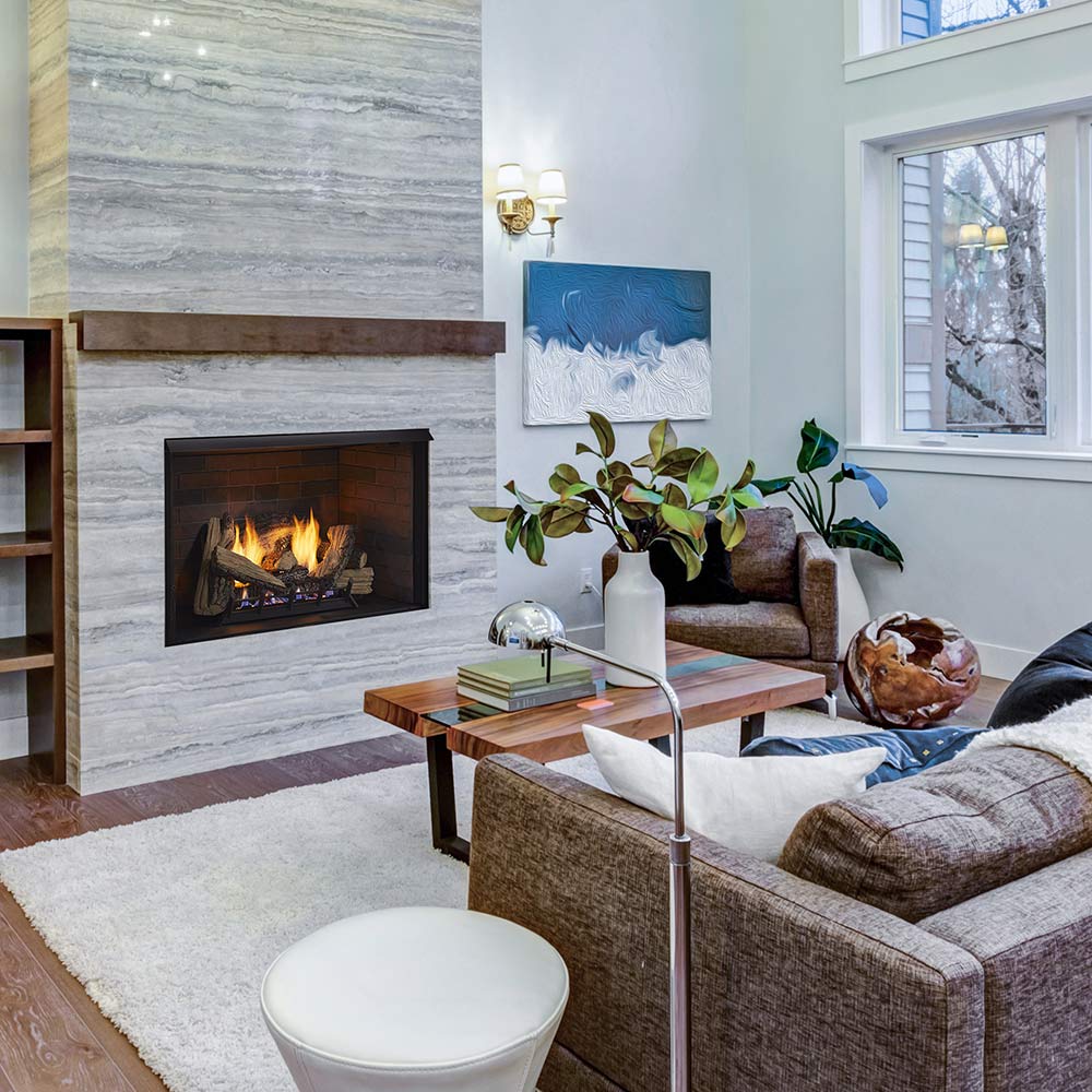 Vent-free firebox insert with burning logs set in dark fireplace opening