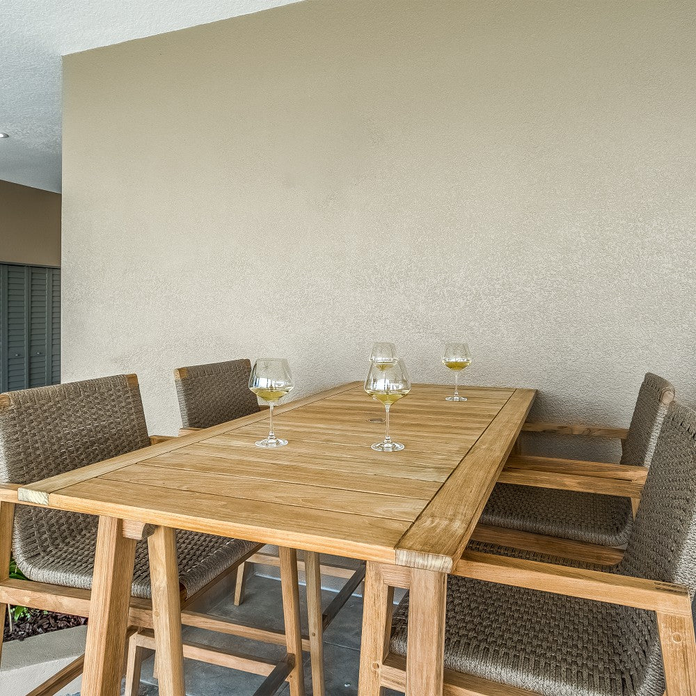 Outdoor bar chair with light wood frame and olive-brown woven seat and backrest.