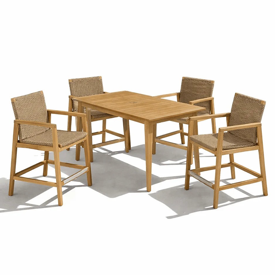 Counter-height dining table with four woven-back chairs, light wood and tan woven seats.