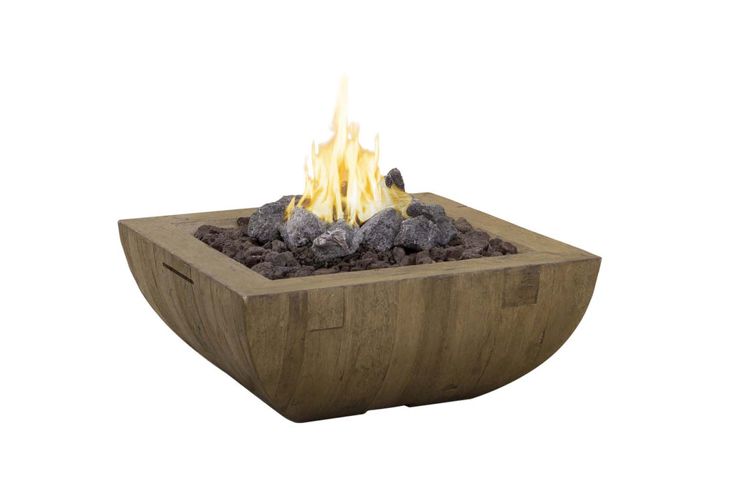 Square gas fire bowl with open flame and dark lava rocks in reclaimed wood surround.